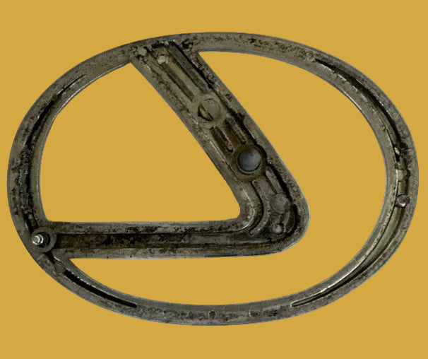Metallic car emblem on a white background