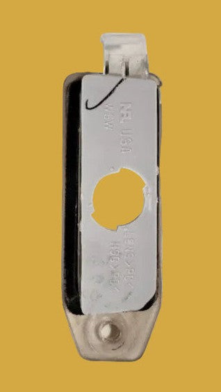 Metallic clip with a circular cutout on a yellow background