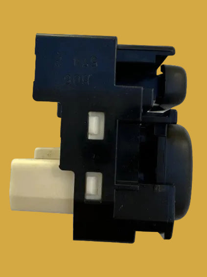 Black and beige mechanical component on a white background