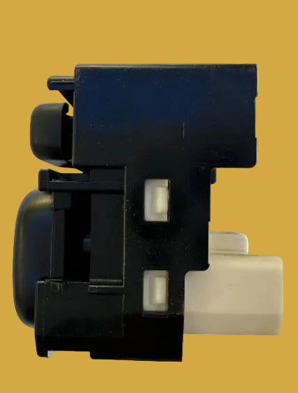 Black mechanical component with white lights on a white background
