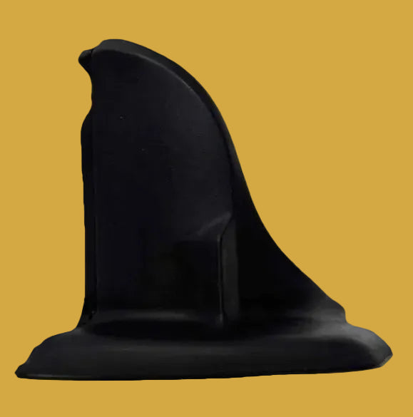 Black suction cup on a yellow background