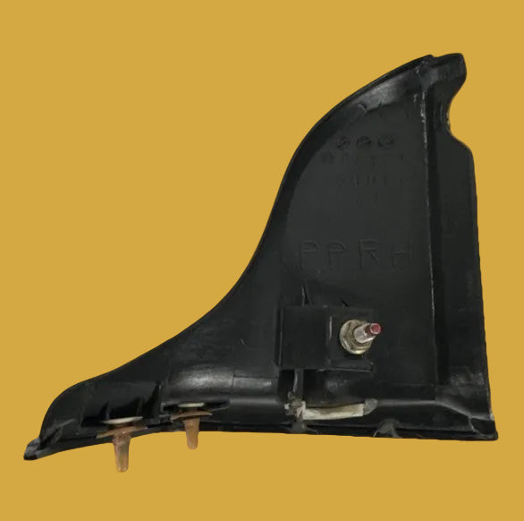 Black car part on a yellow background