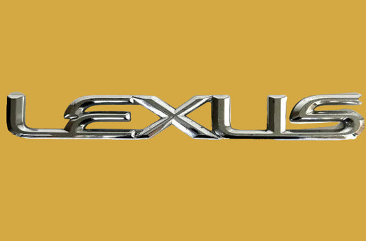 Chrome Lexus logo on a white background