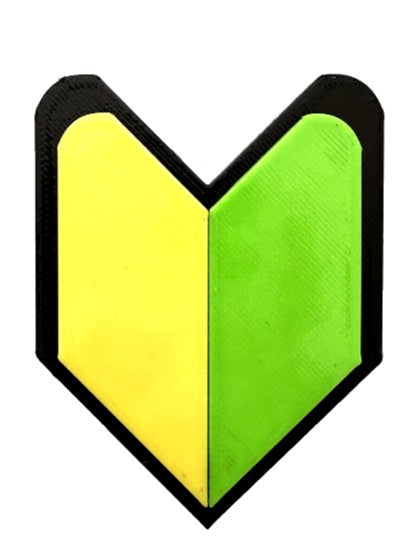 Heart-shaped object with yellow and green sections on a white background