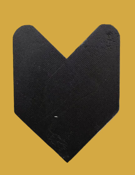 Black V-shaped object on a white background