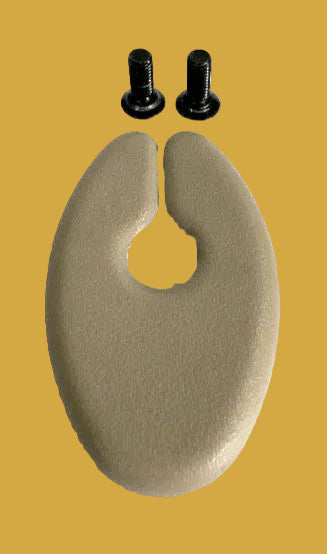 Beige plastic component with two black screws on a white background