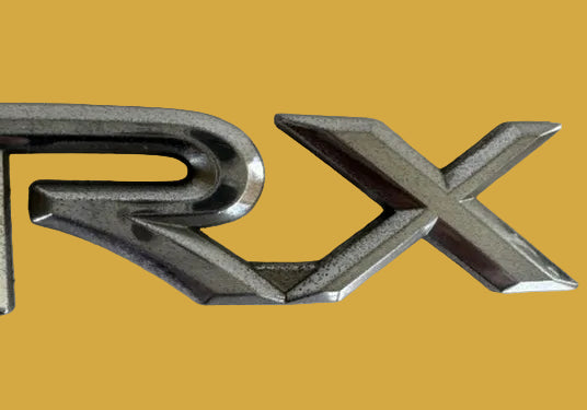 Metallic 'RX' logo on a light background