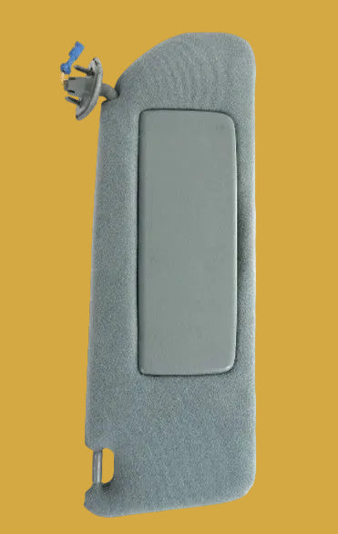 Gray car interior door panel with switch on a white background